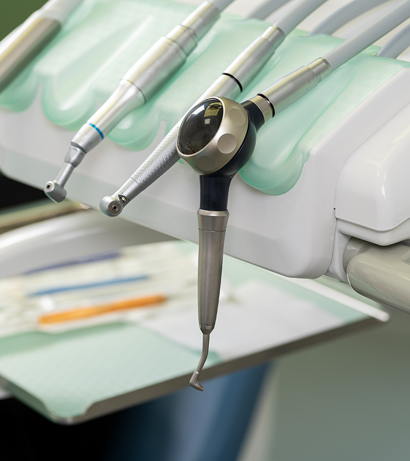 close-up of dental instruments, part of a dental chair